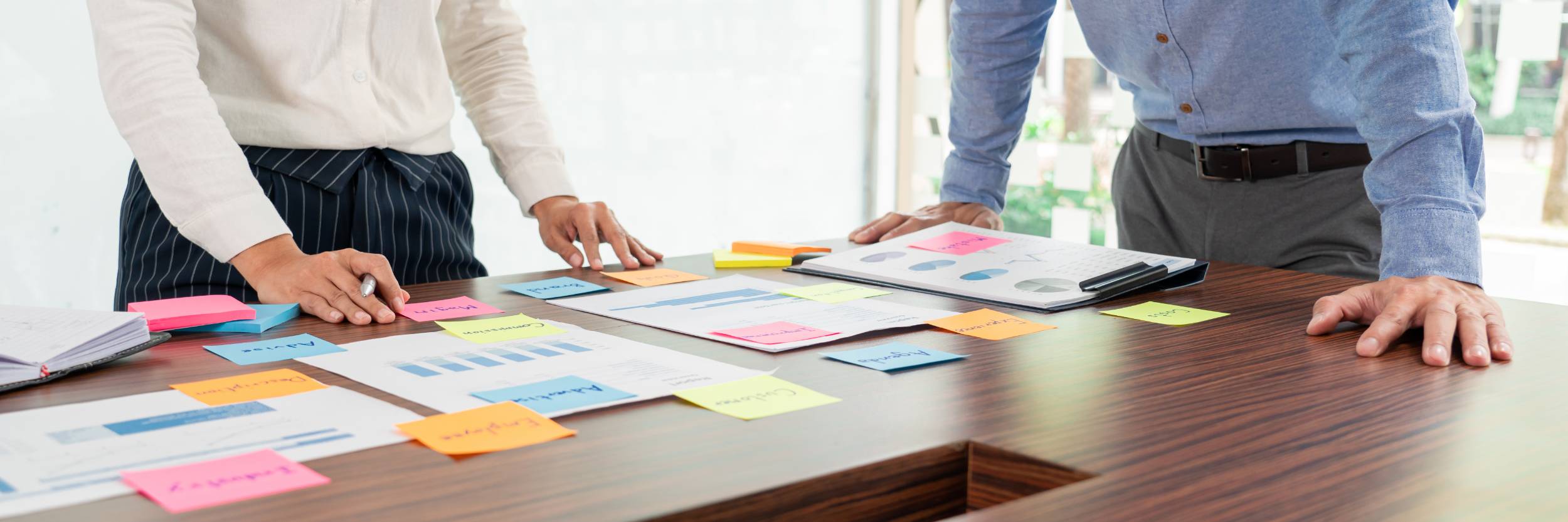 Business people brainstorming with sticky notes