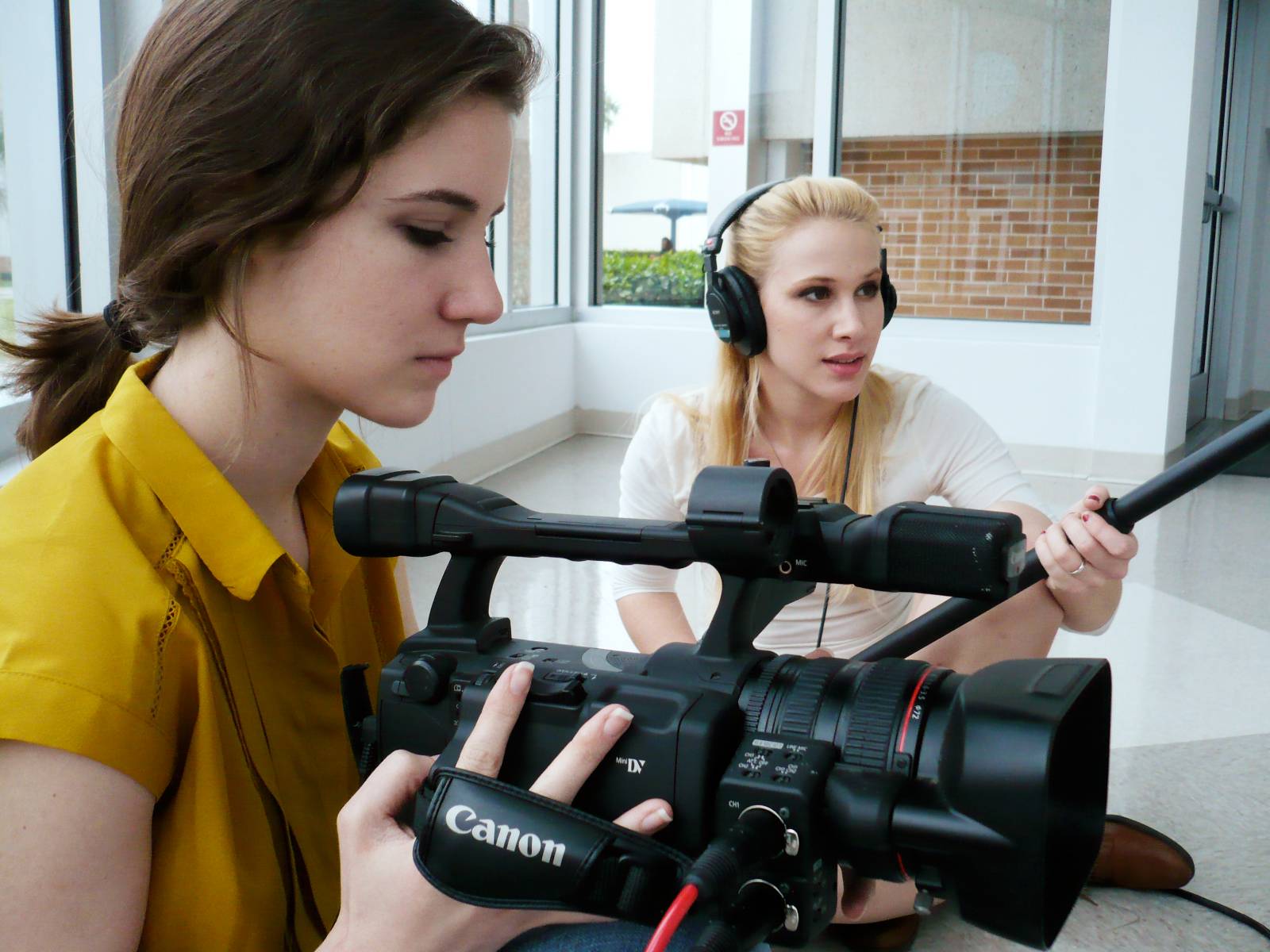 two students operating photography equipment