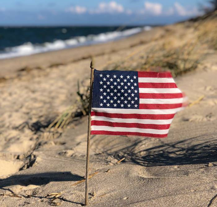 American flag on the beach