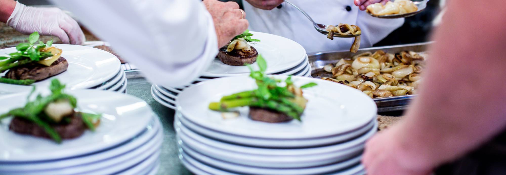 food being plated for service