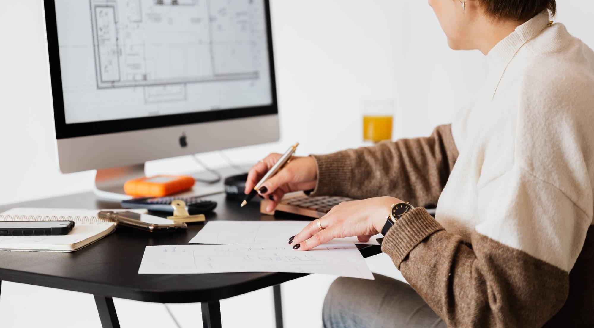 person working on computer draft