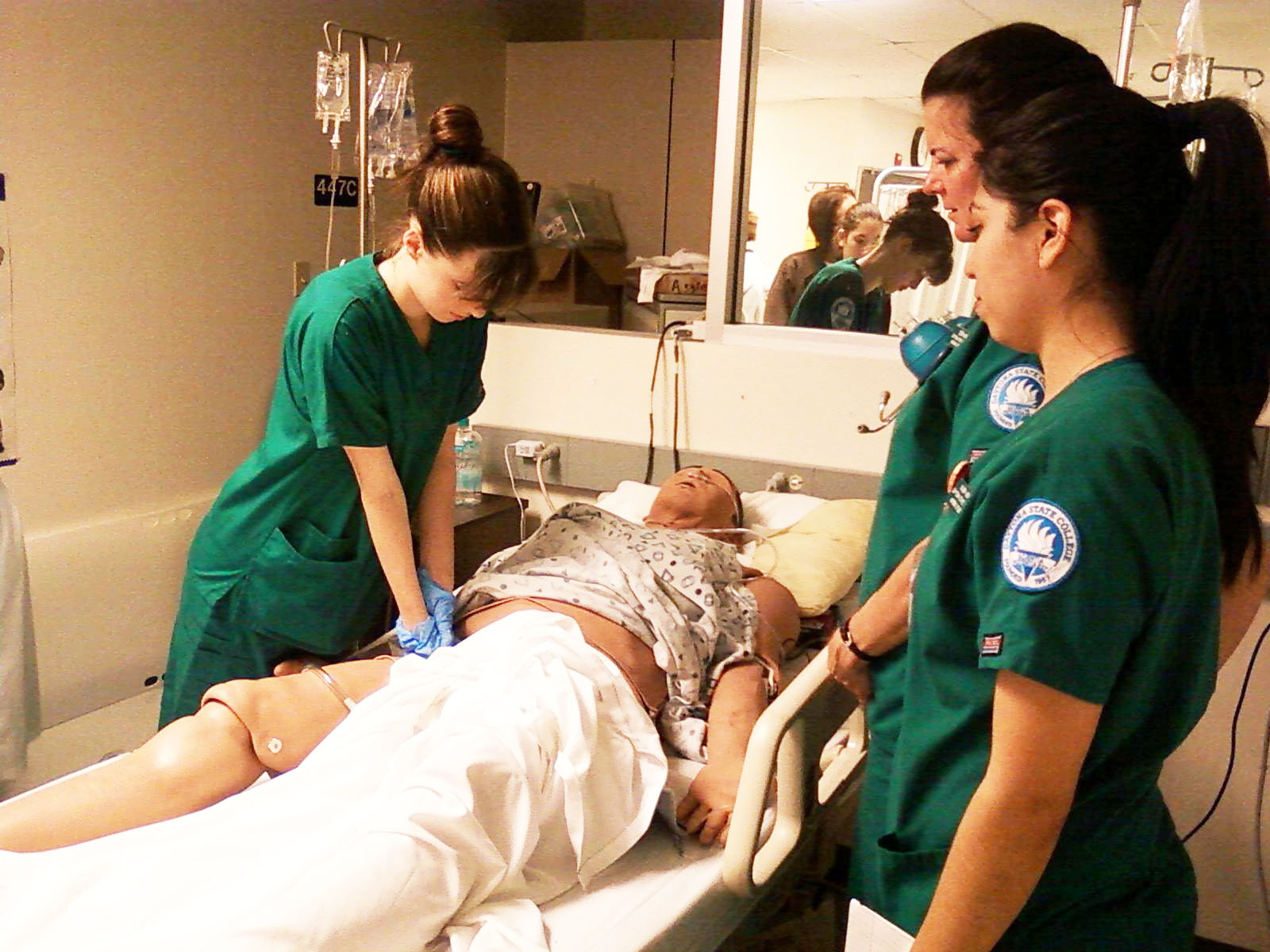 three raspatory therapists standing over patient