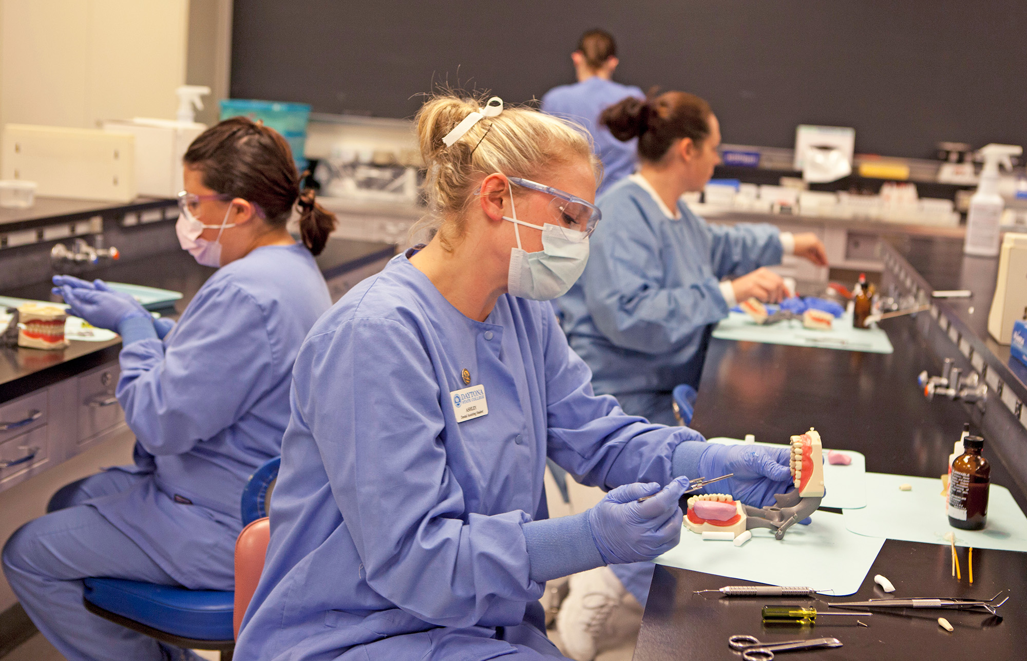 Dental students working in a lab. 