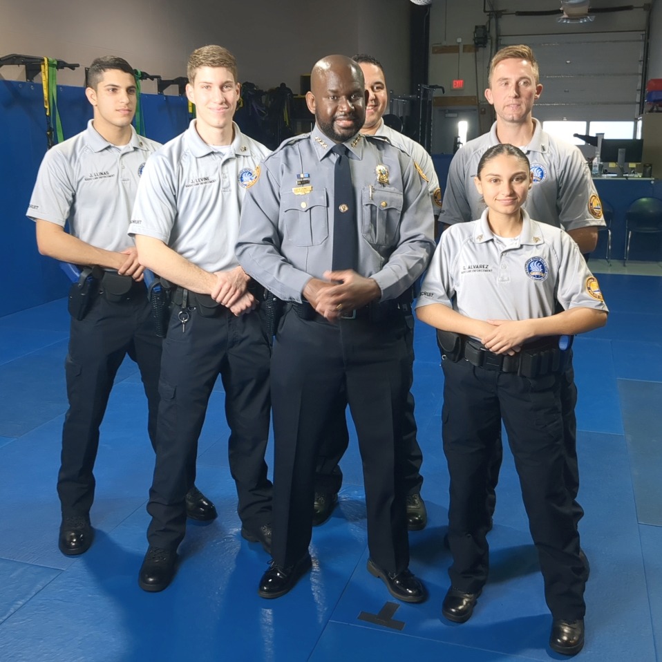 Academy recruits with DBPD Chief Jakari Young. 