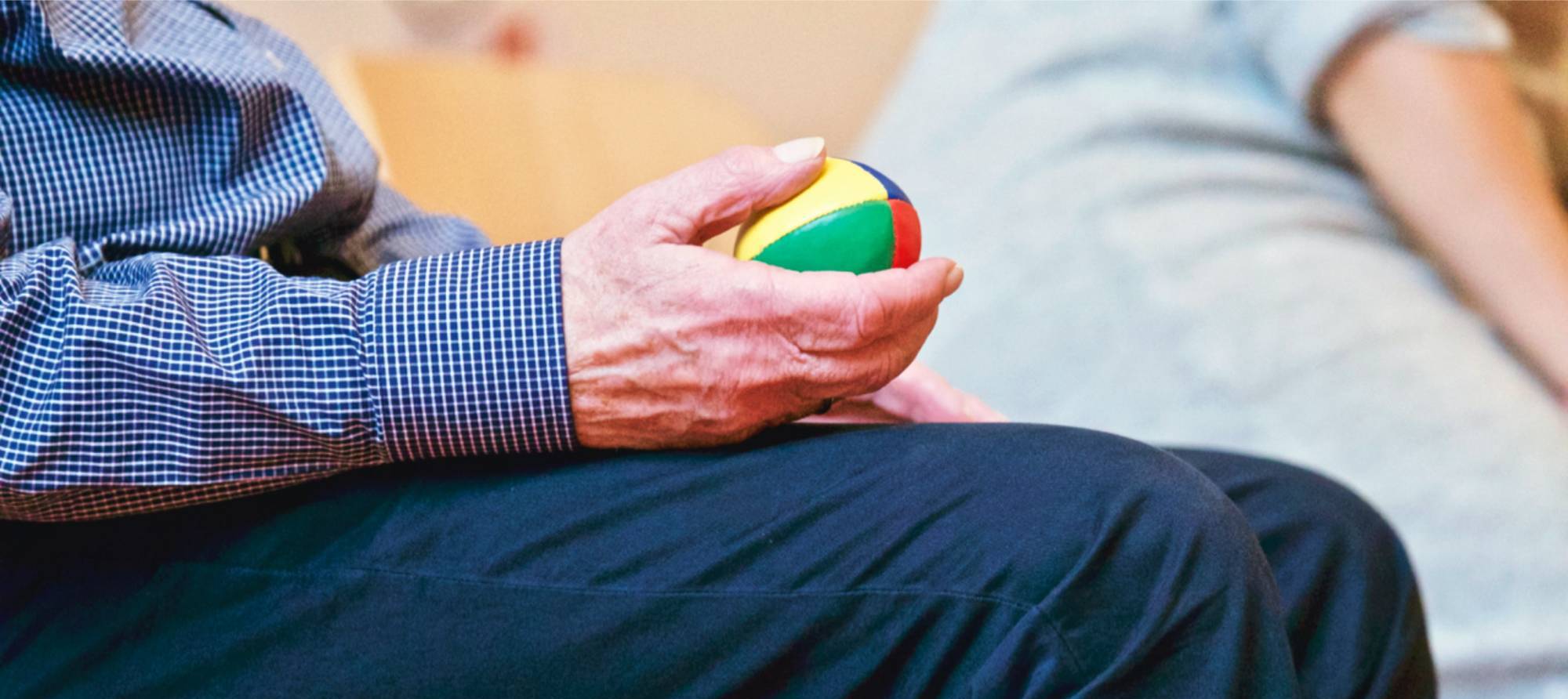 elderly patient with hand ball