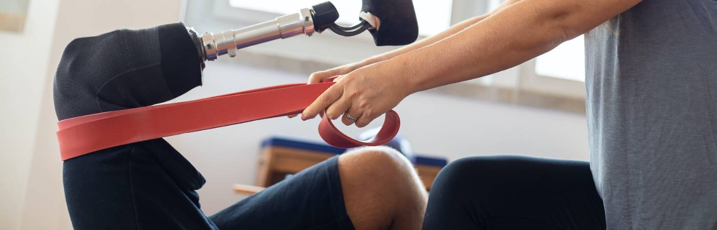 Physical therapist assisting a patient with treatment.