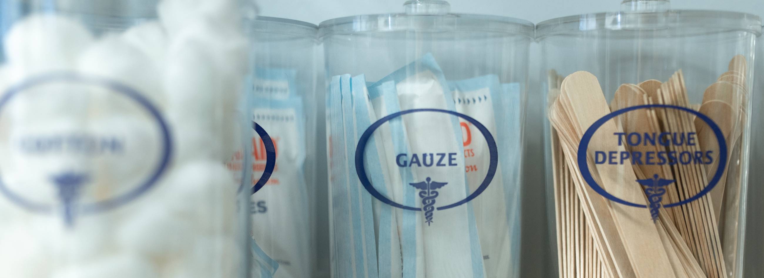 jars with gauze and tongue depressors