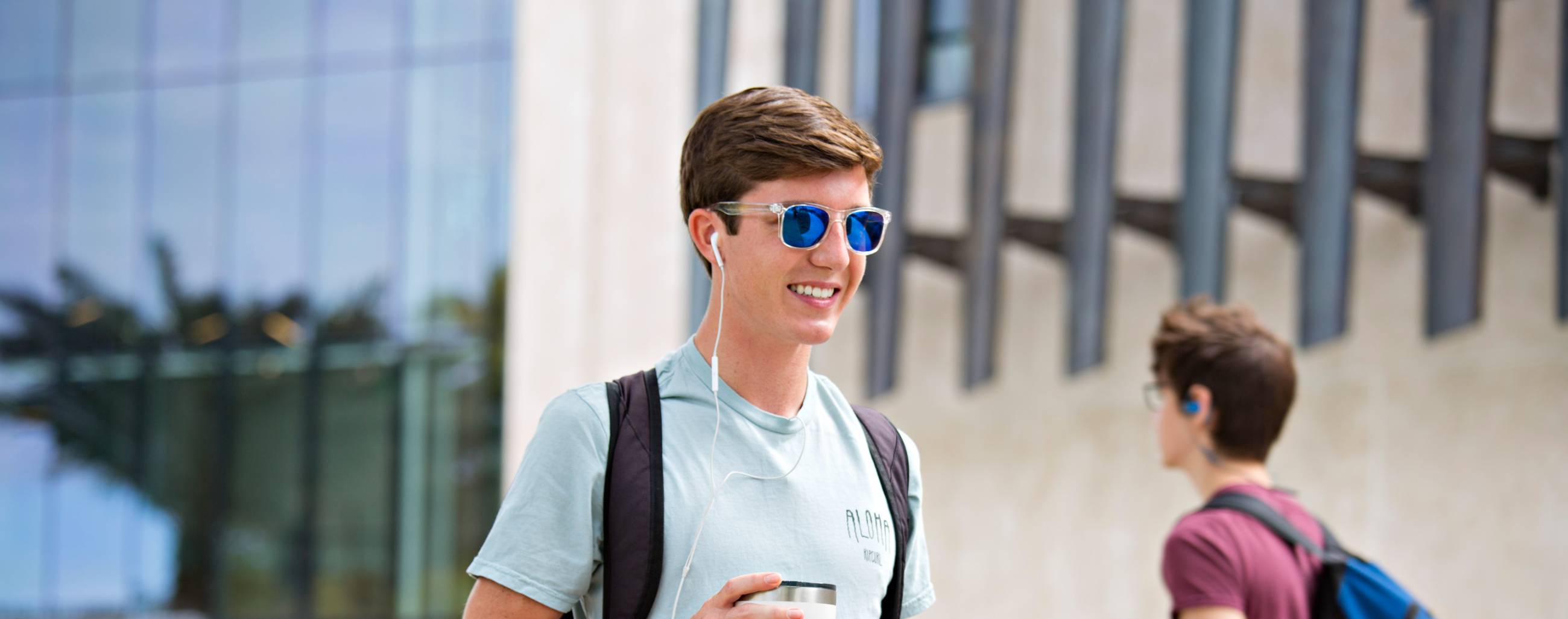 student outside in sunglasses