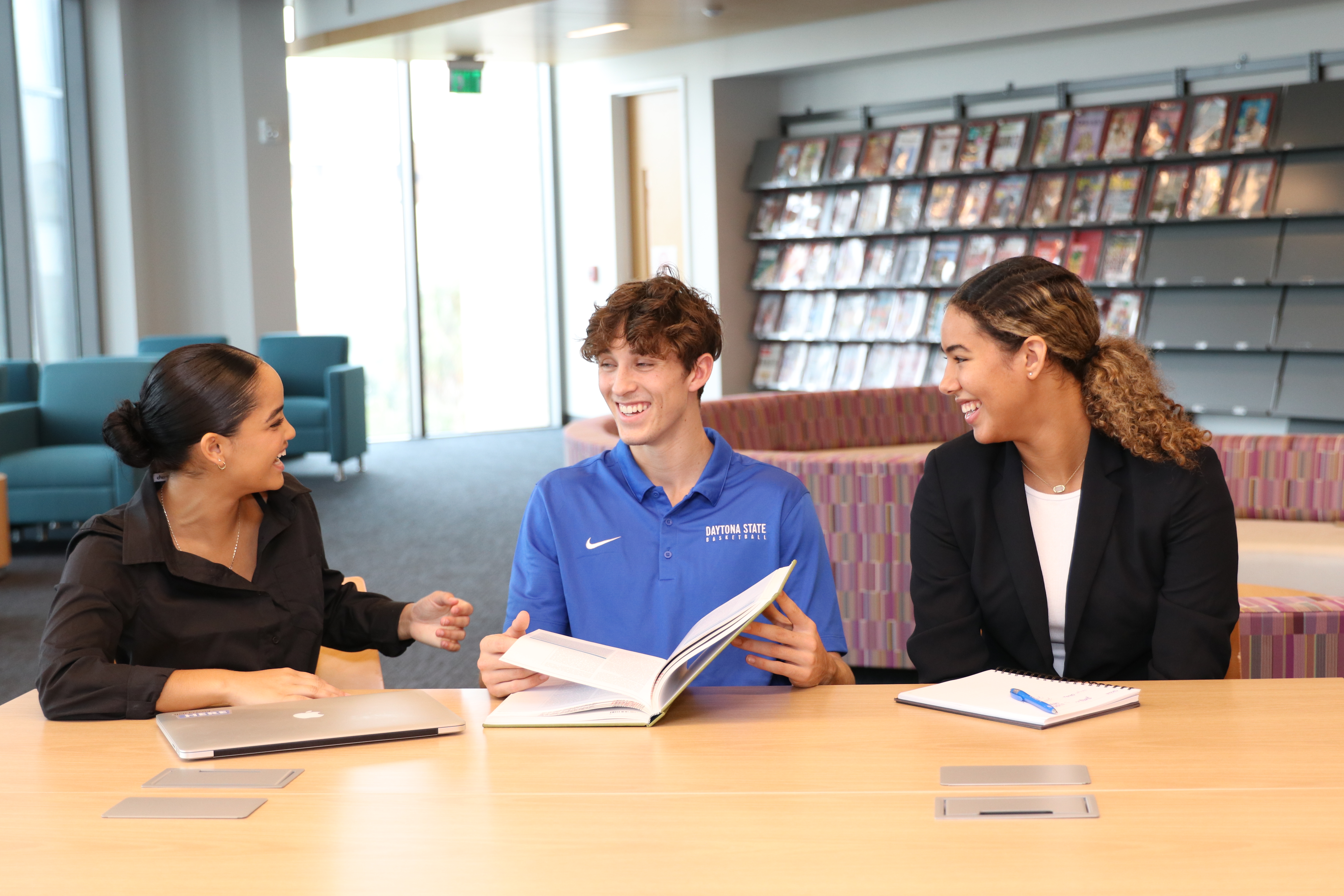 Student workers using a laptop. 
