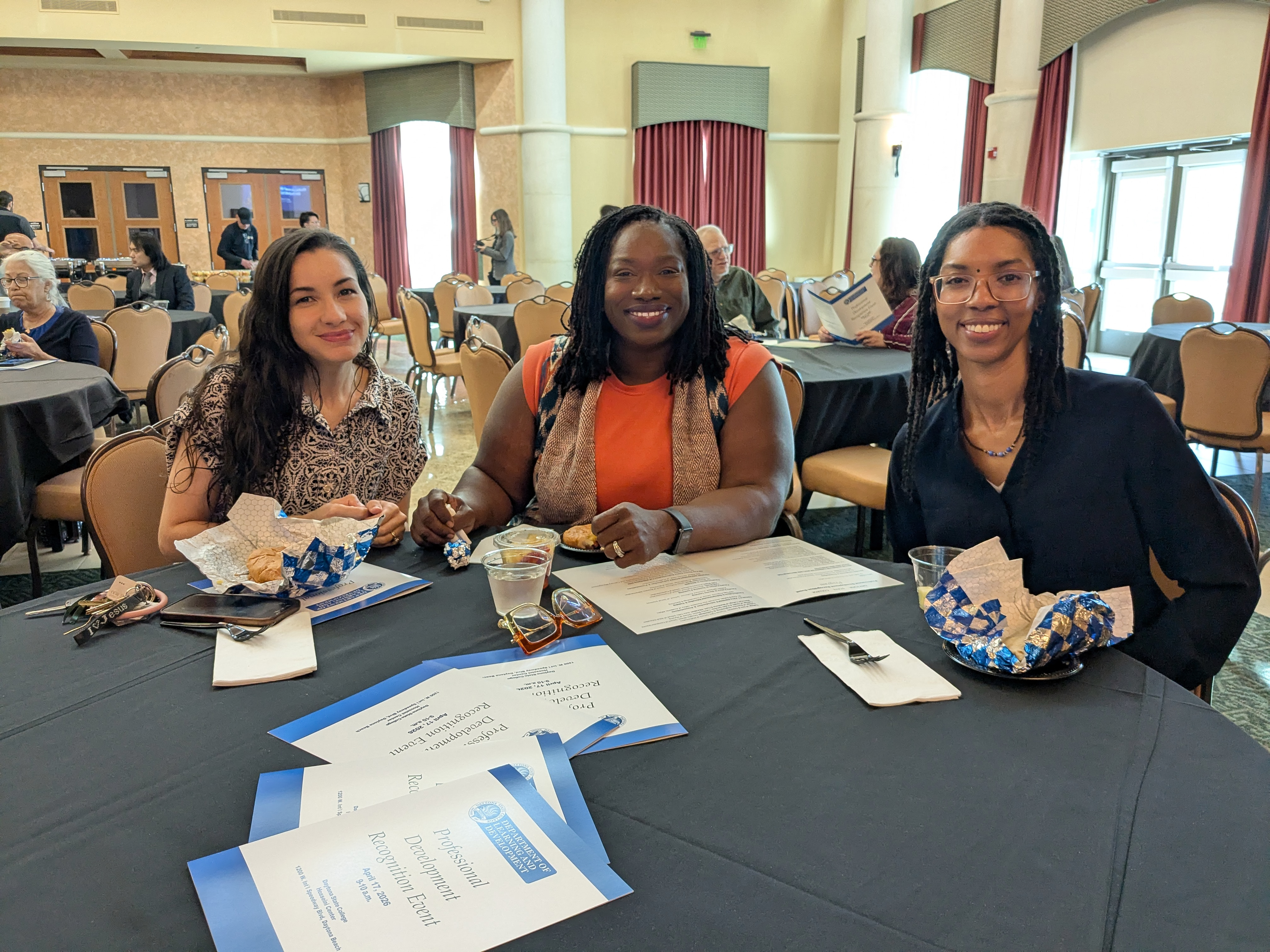 3 Ladies at a table at the Professional Development Event 