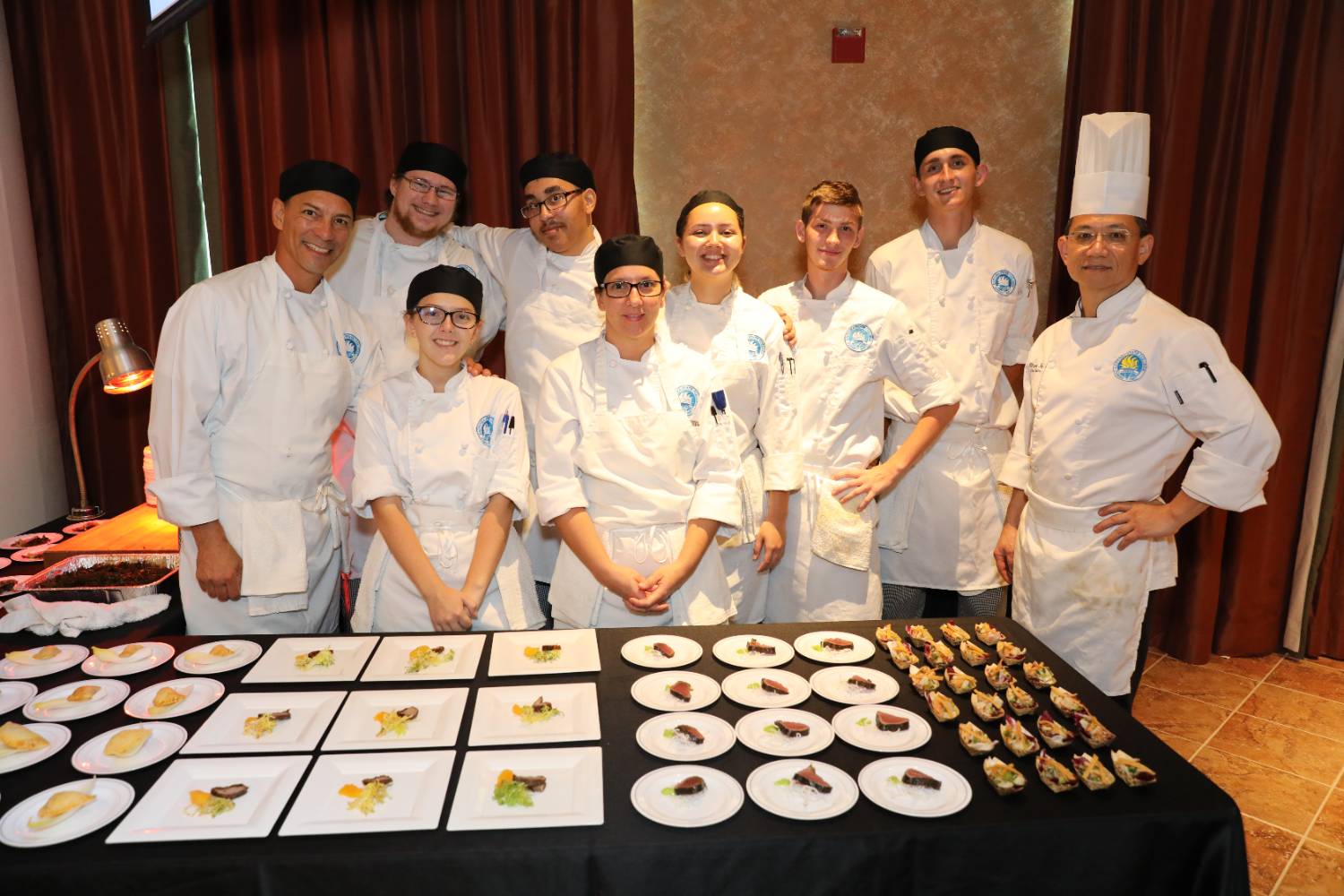 culinary students and chef at annual gala