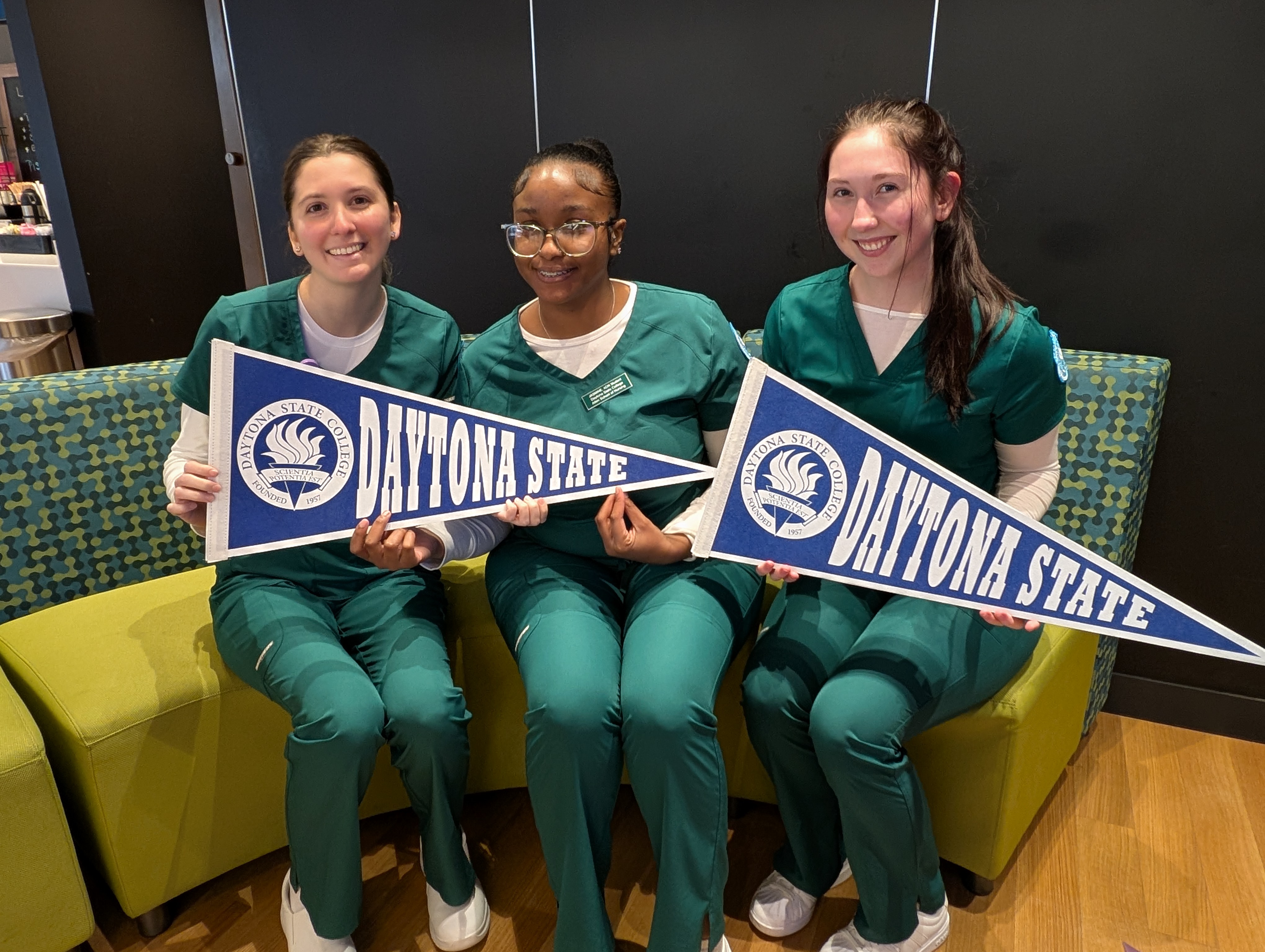 Three nursing students in Mori's Cafe inside the Lemerand Student Center. 