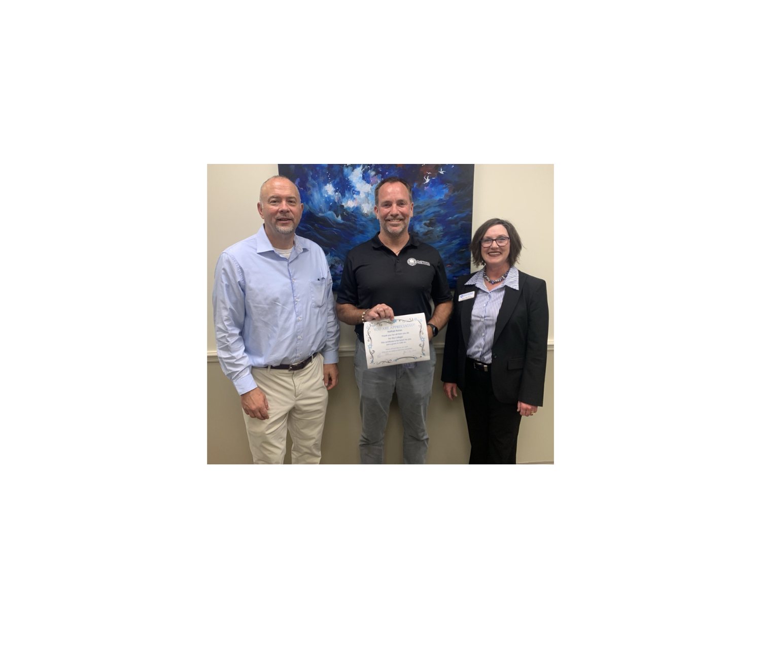 Outstanding employee Nathan Kotas and administrators. 