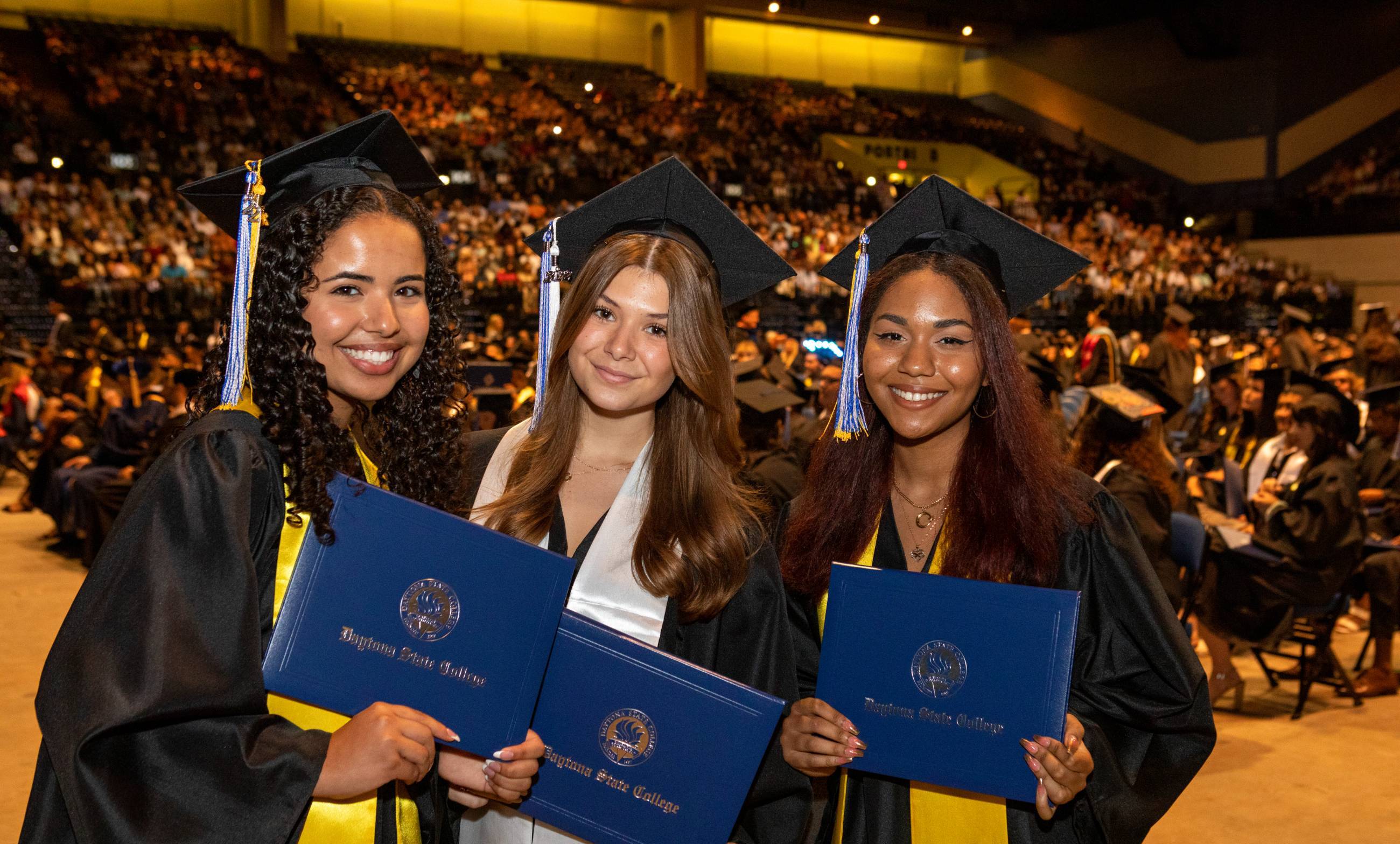 auditorium full of graduates at commencement