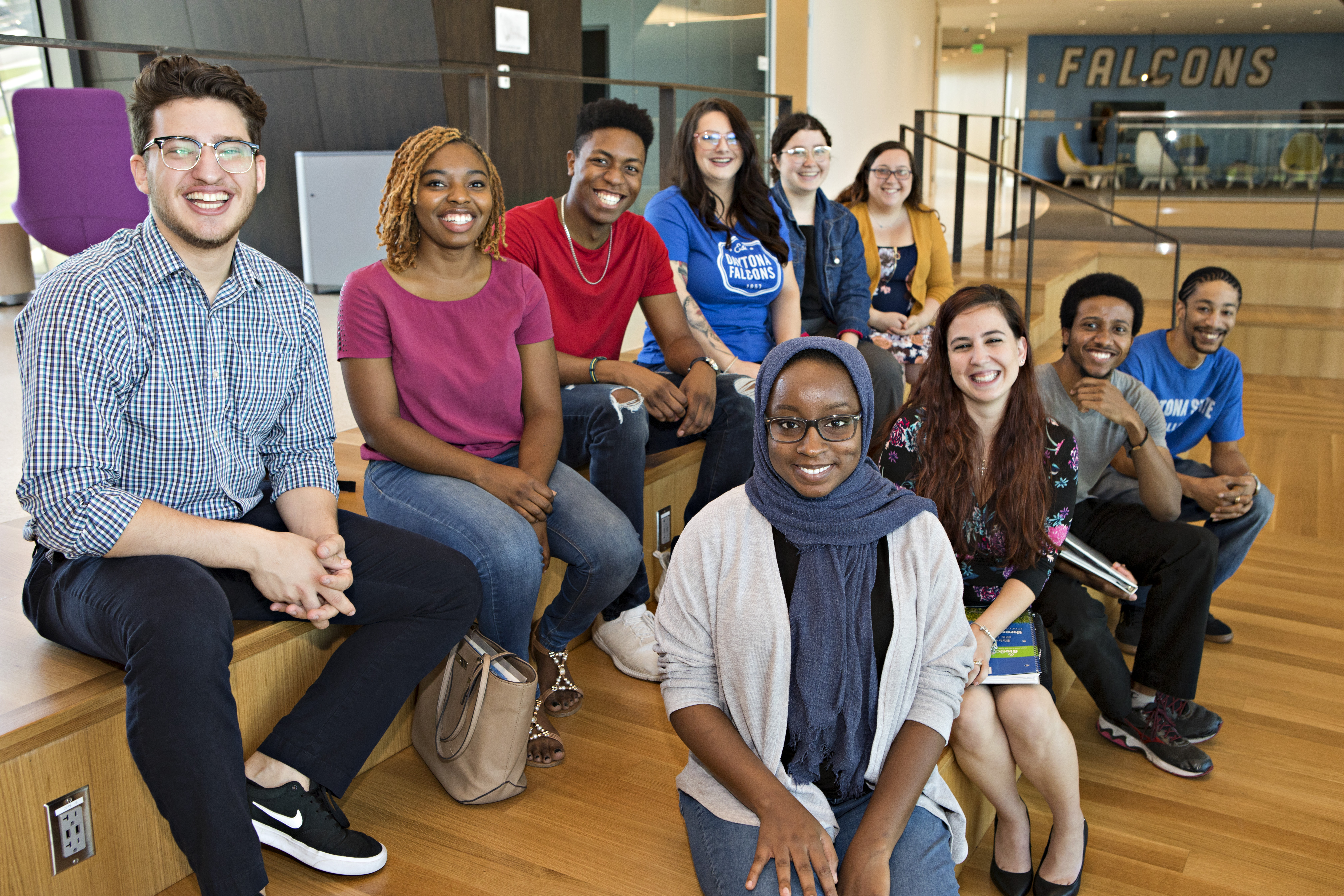 group of diverse student sitting together smiling